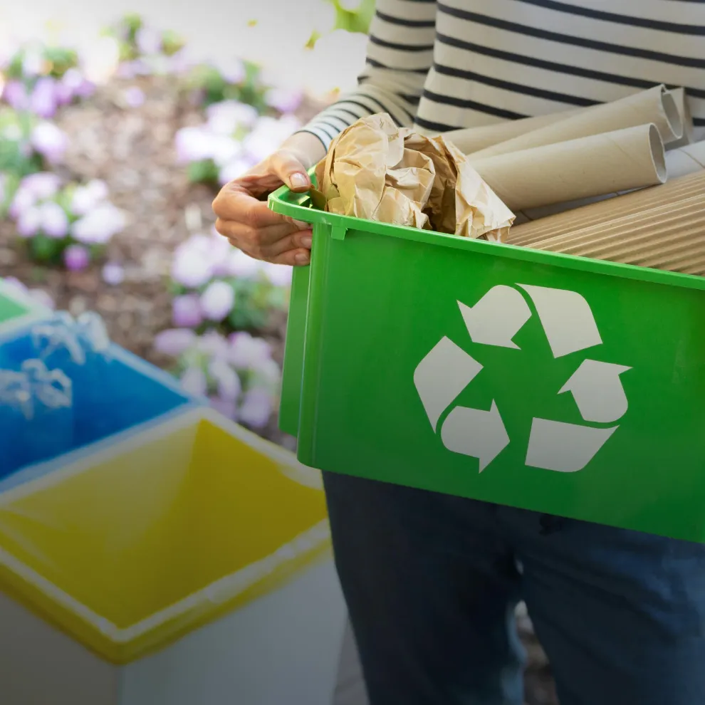 Image of someone taking out their recycling